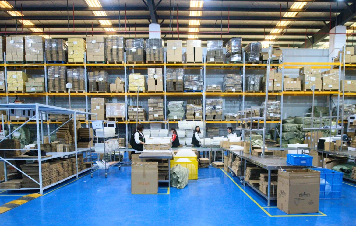 Packing benches backed by warehouse storage.